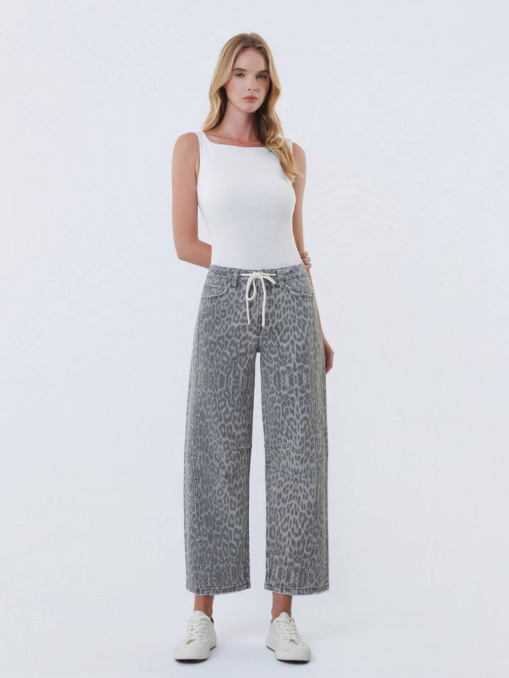 VERVET by Flying Monkey high-rise drawstring grey leopard barrel jeans on model, wide-leg cropped denim with white top.