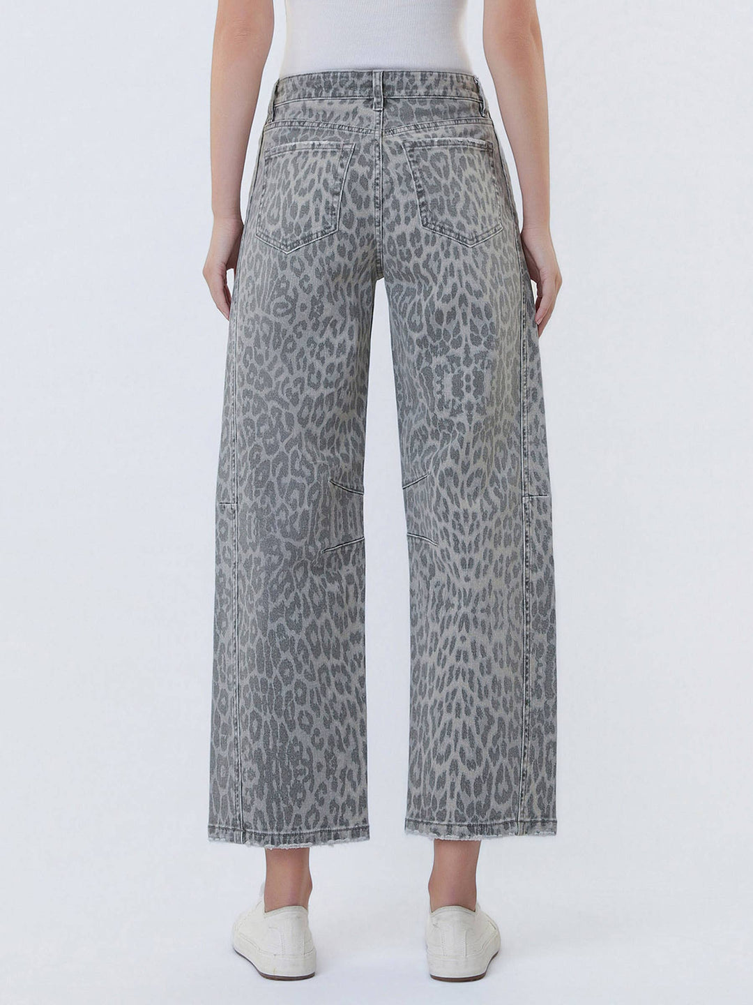 VERVET high-rise grey leopard-print barrel jeans, back view with pockets, model in white top.